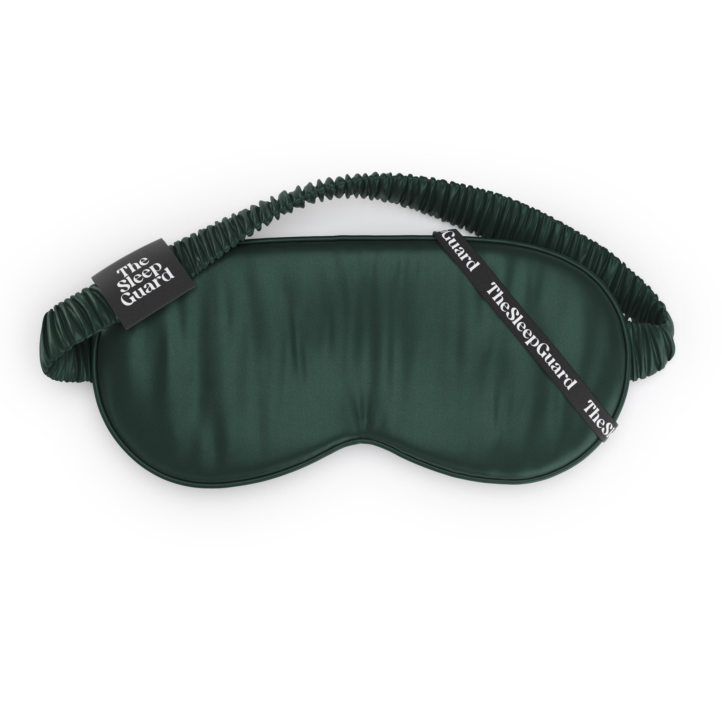 Green sleep mask with black strap on a white background